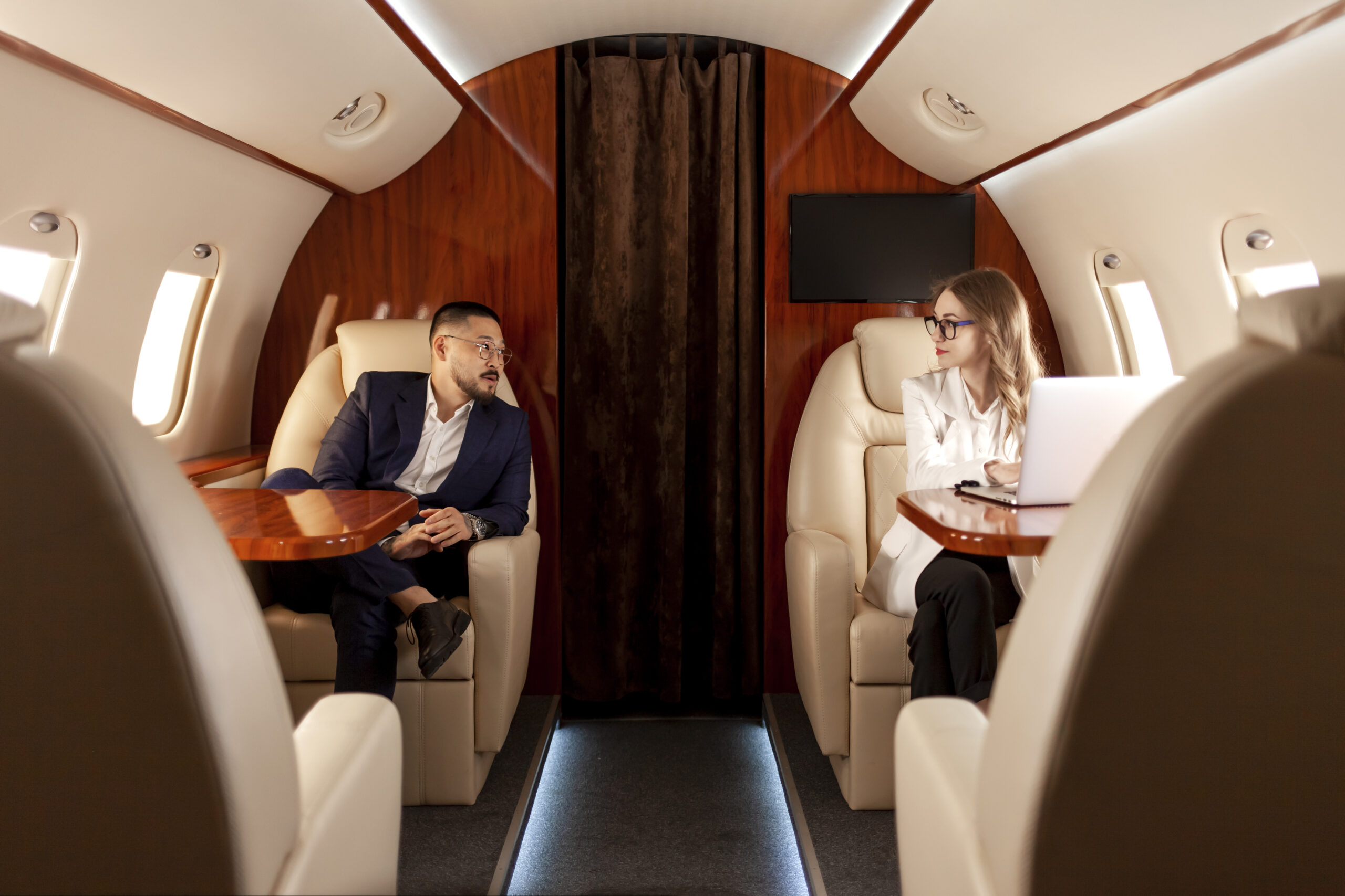 business people are flying private luxury plane asian businessman suit woman manager scaled - Excel Jet